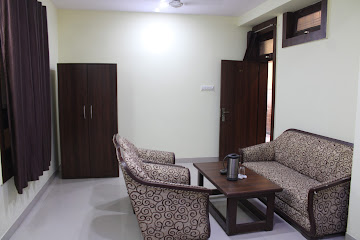 Deluxe double room with king bed at New Hotel Sanskar